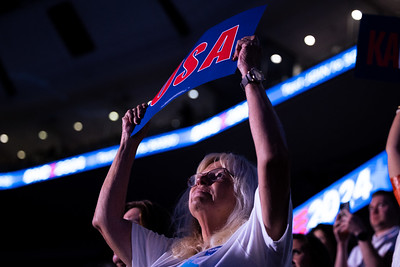 An attendee holds up a sign reading "USA" on Wednesday, Aug. 21 at the Democratic National Convention. More than two dozen members of Democratic leadership were recognized on stage for their military service.  Uploaded to Flickr October 2, 2024