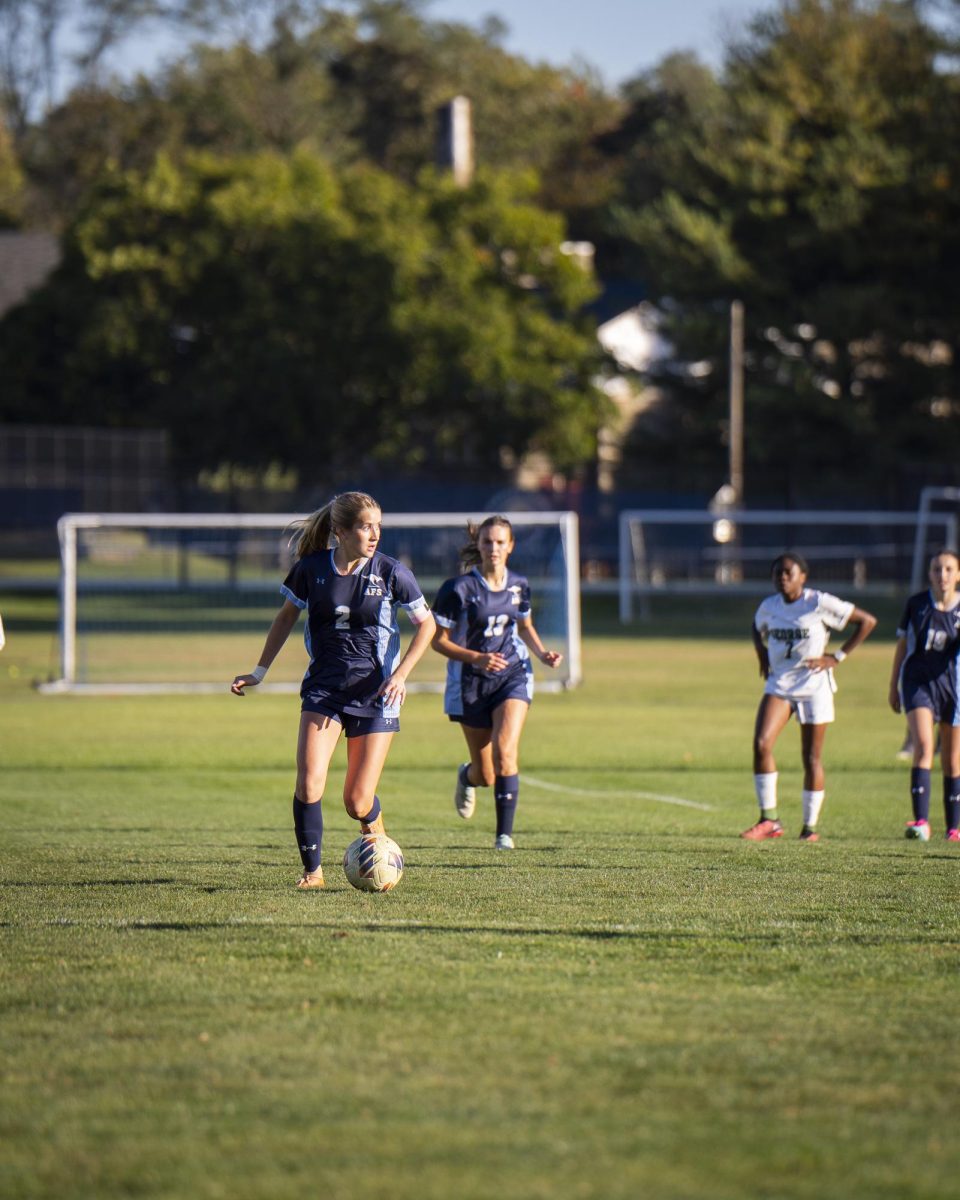 Image of AFS girls sports team (soccer team) in action. 