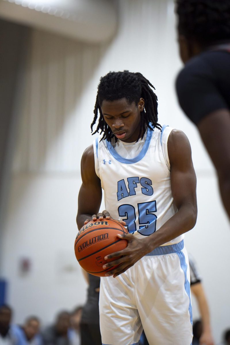 Robert Spruill '26 preparing to take a shot