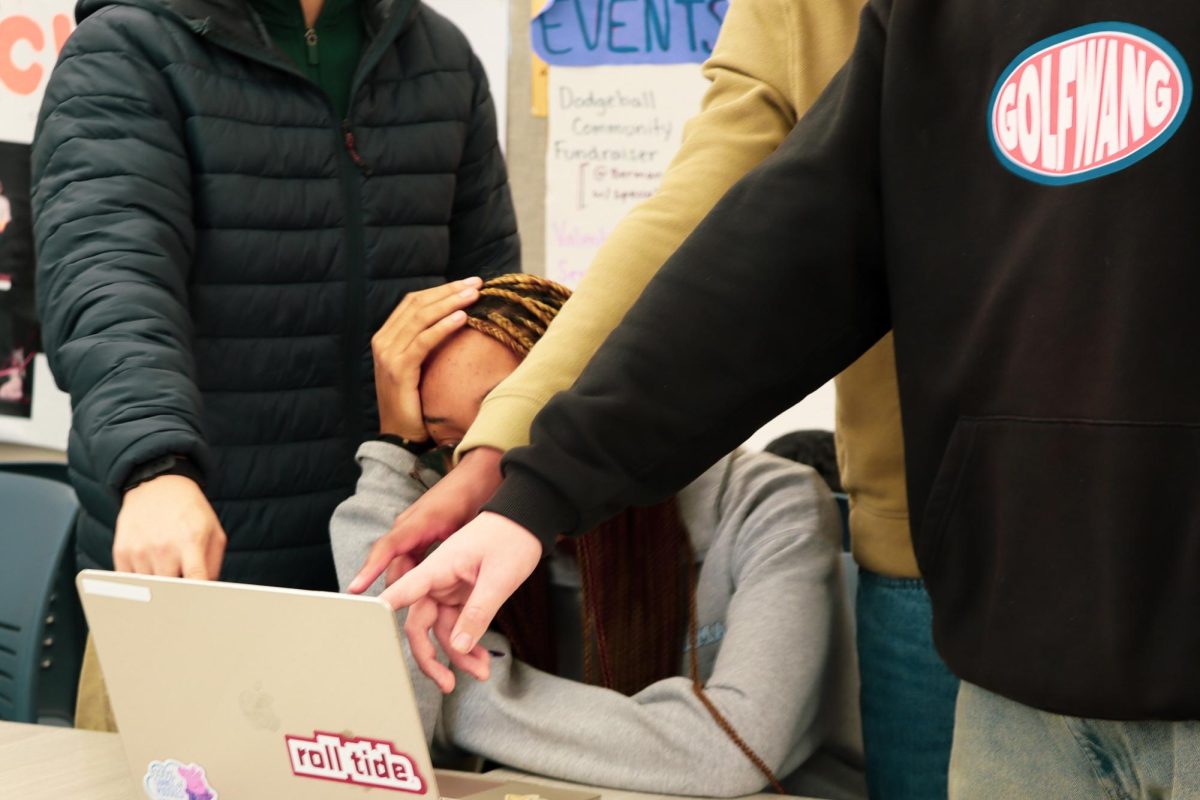 Students Ella Hawkins '26, Jaylan Moore '27, Brendan Zhang '26, and Aidan Schmidt '27 act out "mansplaining" 