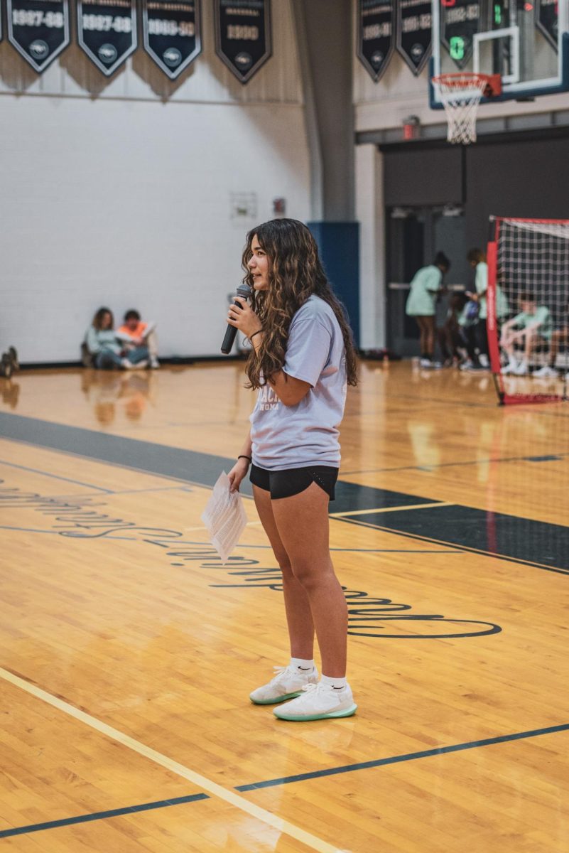 Marley Fields '26 giving a speech during Kicks for Cancer. 