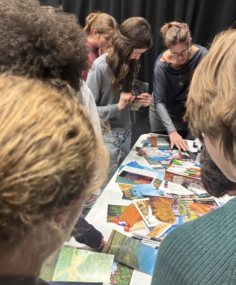 The cast of Twelfth Night creating a collage of what they want the show to be like.